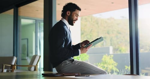 Happy, business and man with tablet in office for research, proofreading article and update draft