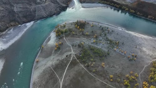 Aerial view of a river island in a mountain valley