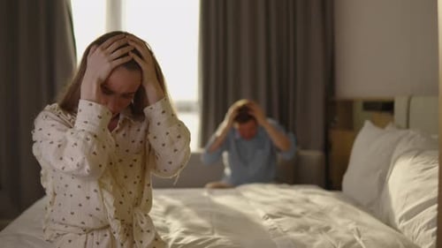 Young Couple Arguing in Bedroom During Tense Relationship Conflict Angry Woman Gesturing Emotionally