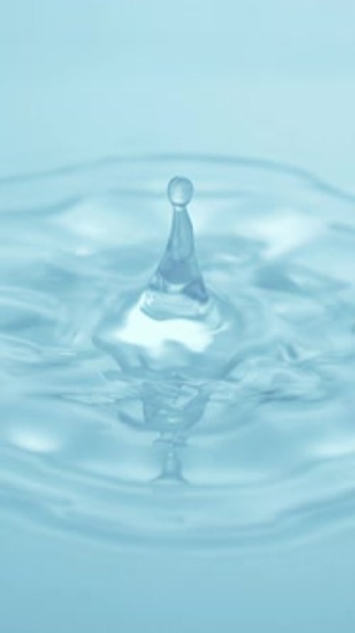 Water Drop Impact Creating Ripples