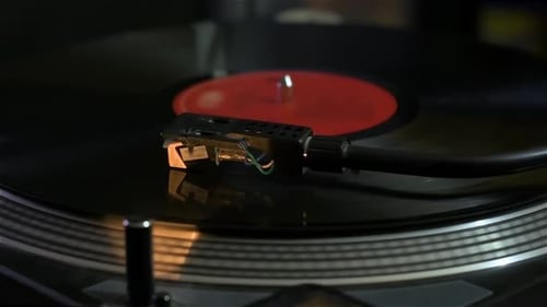 Detail of record player playing a song. Turntable.