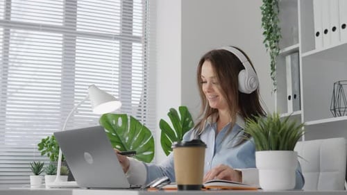 A Woman Works From Home on the Internet The Concept of Online Learning and Distance Education A