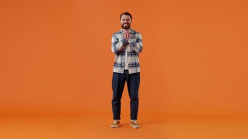 Bearded Man in Plaid Shirt Making Wish Showing Prayer Gesture and Crossing Fingers