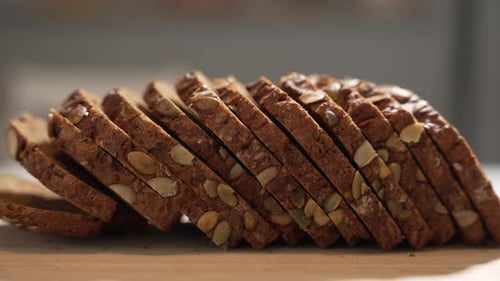 Dark Sliced Seed Bread on Wooden Surface
