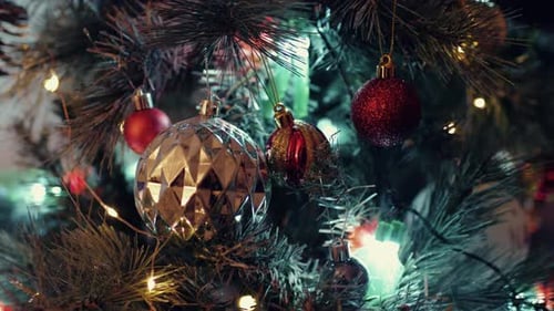 Ornaments Hang on Christmas Tree with Fairy Lights