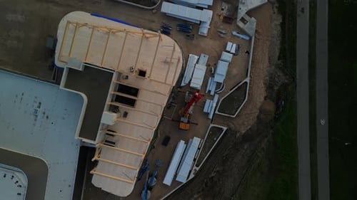 Construction Site with Workers Equipment and Building Foundation Contribute to a Dynamic Project in