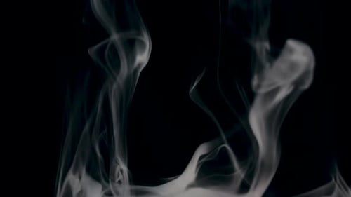 Dramatic White Smoke Swirling on Black Background