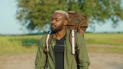 Portrait Young African American Man with Backpack 3D Identification Scan Information Look at Camera