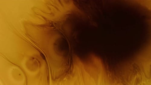 Abstract Amber Fluid Marbling and Mixing Texture