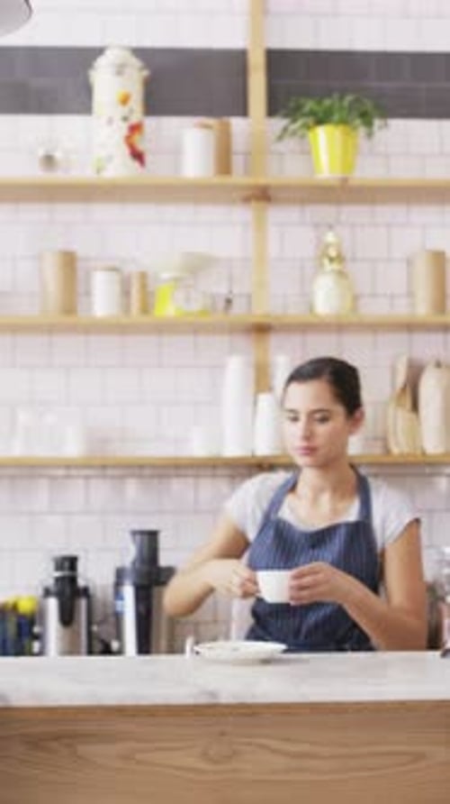 Happy woman, face and barista with coffee in cafe for serving, hospitality or catering