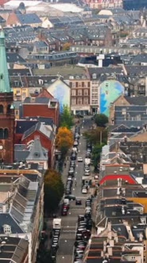 Aerial drone view of Vesterbro district in Copenhagen, Denmark in daylight. Vertical