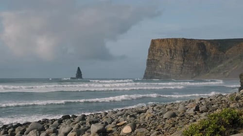 Shot of the ocean by a large cliff in south of Portugal