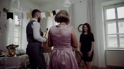 Friends Gathering at an Indoor Birthday Party