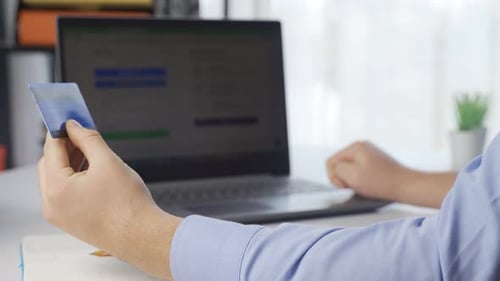 Person Using Laptop and Credit Card For Online Shopping