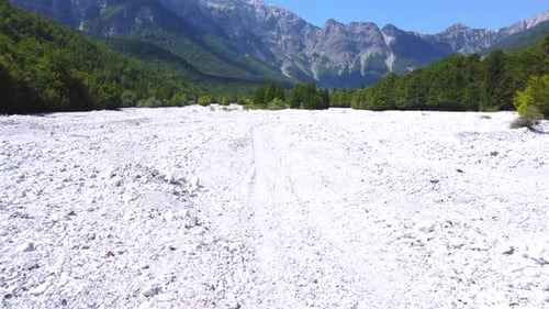Dry river trail heading to Rragam along the dry river in summer through the Valbona valley, Theth na
