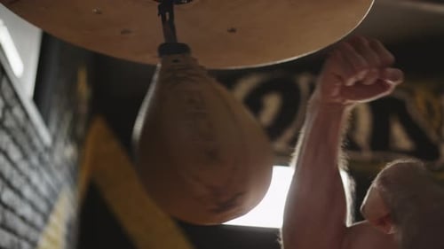 Fists of Boxer Hit Punch Bag. Preparing for Boxing Competition. Close Up
