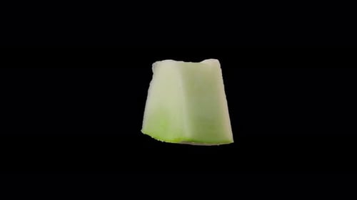 Close-Up Shot of Rotating Wedge of Honeydew Melon