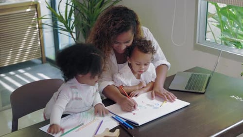 Mother Drawing with Two Children at Home