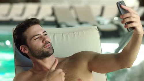Close Up of Sexy Man Making Selfie Photo on Mobile Phone Near