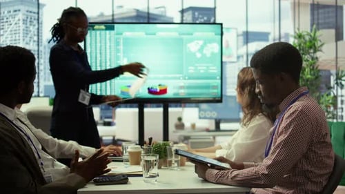 Business Professionals in Meeting Discussing Charts and Data