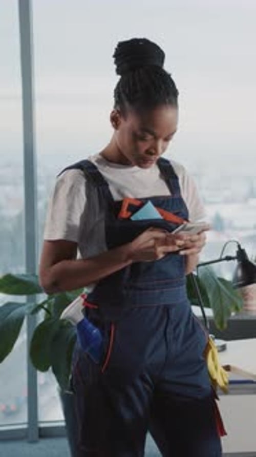 Caucasian Young Man in Cleaning Uniform Doing Cleanup Service in Corporate Office Lazy Afroamerican