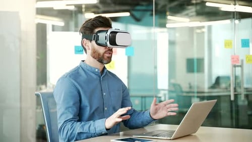 Man Using VR Headset at Work in Office