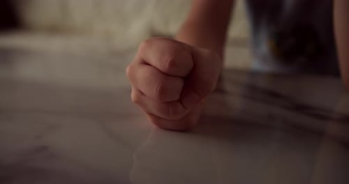 Close Up Fist of Angry Child Beats on Table Slow Motion Little Angry Kid Little Boy Child Pounds on