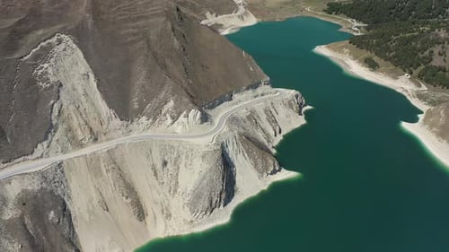 Aerial Alpine Lake Turquoise Water Surrounded By Picturesque Spring Mountains