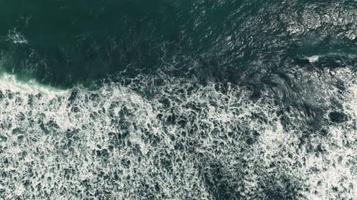 Aerial view, top view of sea waves on beach sand