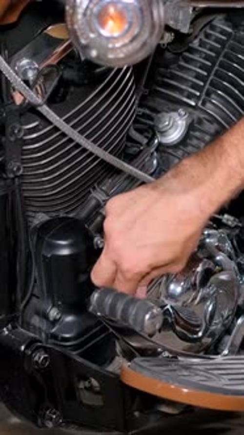 A Mechanic Repairs a Motorcycle at a Service Station Beautiful Motorcycle Vertical Video