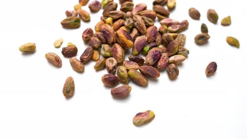 Pistachio Nuts View On White Table Background