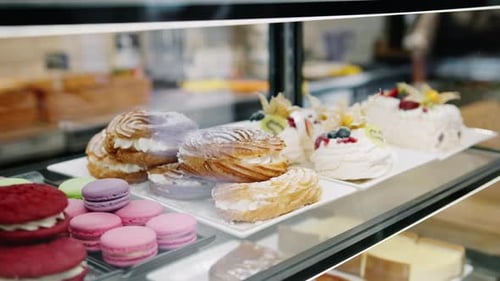 Counter full of delicious buns and pastries in a shop, bakery