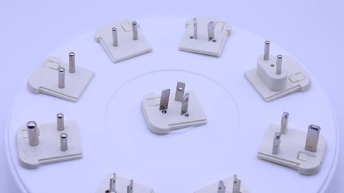Electrical Plugs Rotating on White Surface