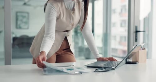 Professional Woman Working at Desk on Laptop Computer