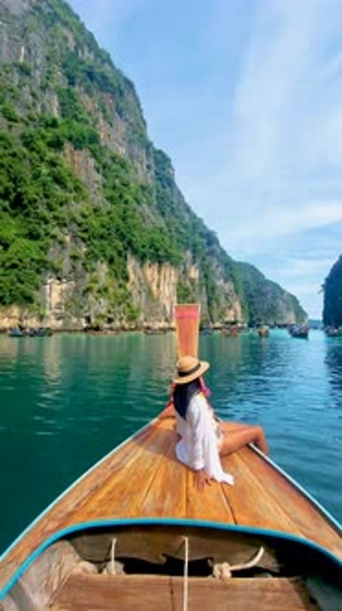 Pileh Lagoon with Green Emerald Ocean at Koh Phi Phi Thailand Women in Front of Longtail Boat