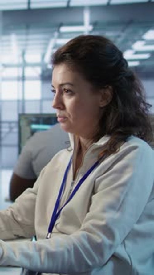 Woman Works in Data Center Server Room