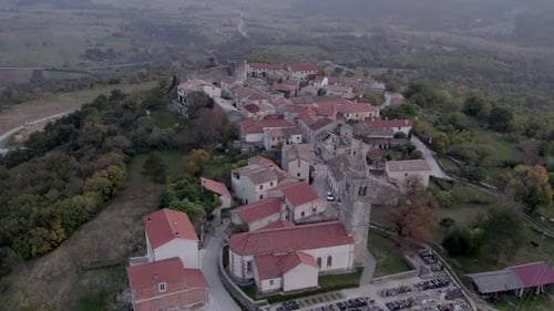 Aerial view of historic town with church at sunset, Croatia.