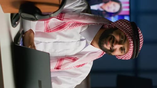 Focused Man Working at Computer in Modern Office