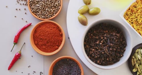 Top view, spices and curry on table in kitchen for cooking, food or seasoning collection with color