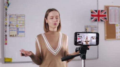Woman Teaches English in a Classroom on Video