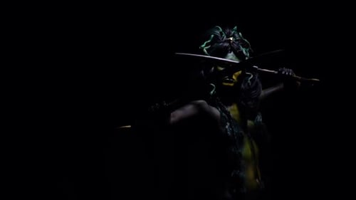 Woman in Body Paint Posing with Swords