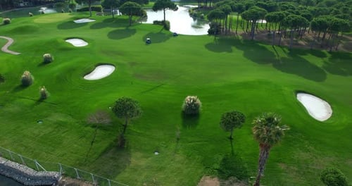 Aerial View Around Beautiful Pond Located on Green Golf Course