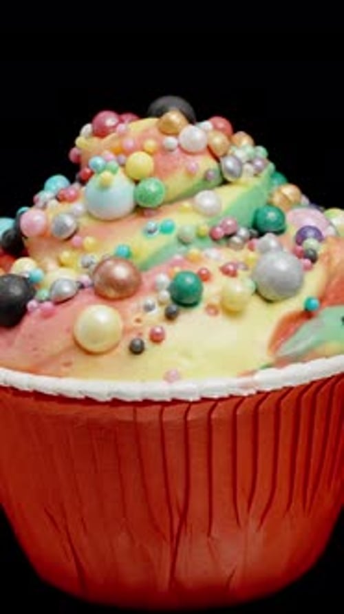 Rotating Cupcake with Colorful Frosting and Candy Sprinkles