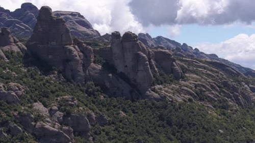 Breathtaking rocky Montserrat panorama, scenic aerial drone flying above mountain range in Catalonia