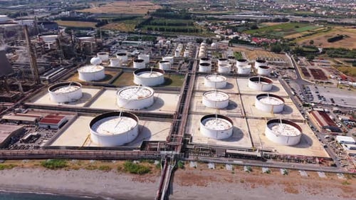 Drone Orbiting Over Oil Storage Tanks at Refinery in Sicily