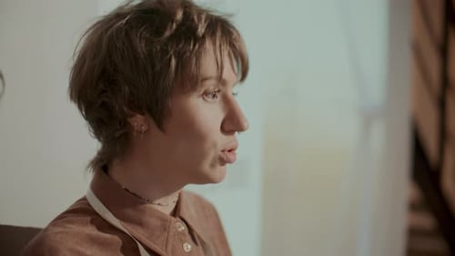 Young Woman Giving a Presentation in a Modern Office