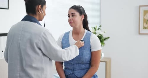 Doctor, woman and breathe in office with stethoscope for respiratory exam, heart assessment or test