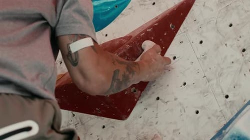 Man Climbing Indoor Climbing Wall, Close Up