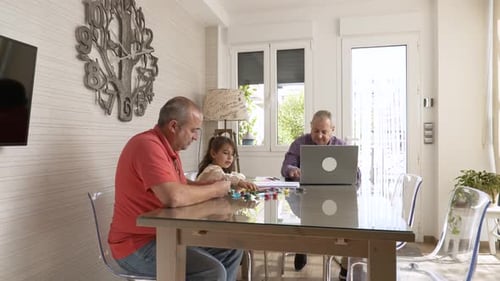 Family Doing Activity Together at Dining Table