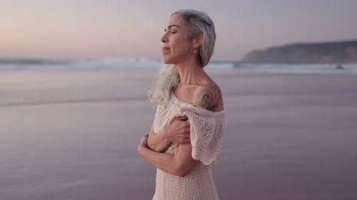Serene Senior Woman at Beach Embracing Aging Finding Peace
